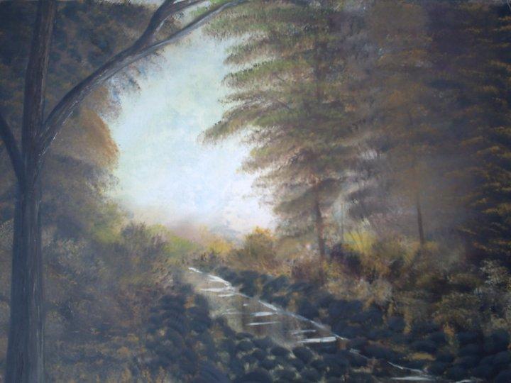 Misty forest path toward a clearing